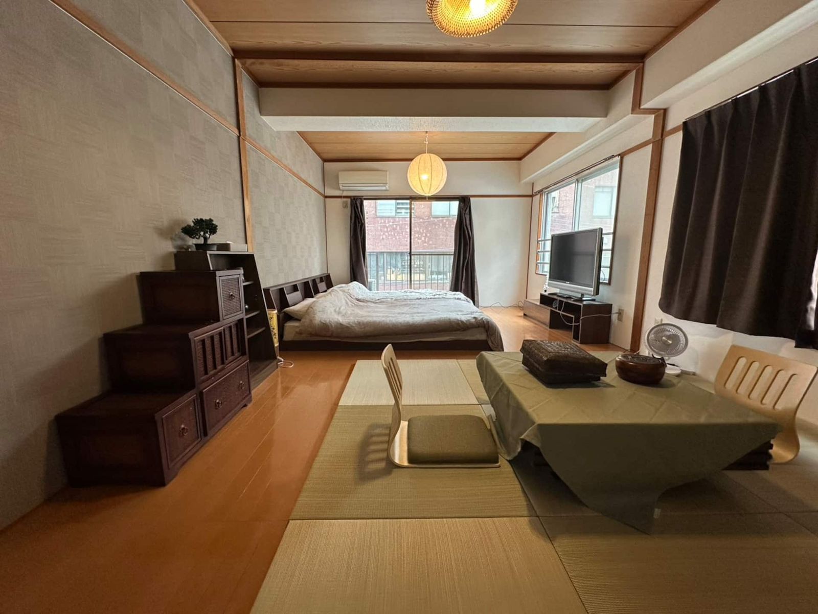 Rikyu (302): a tatami room with a low table, a step chest and a paper lantern